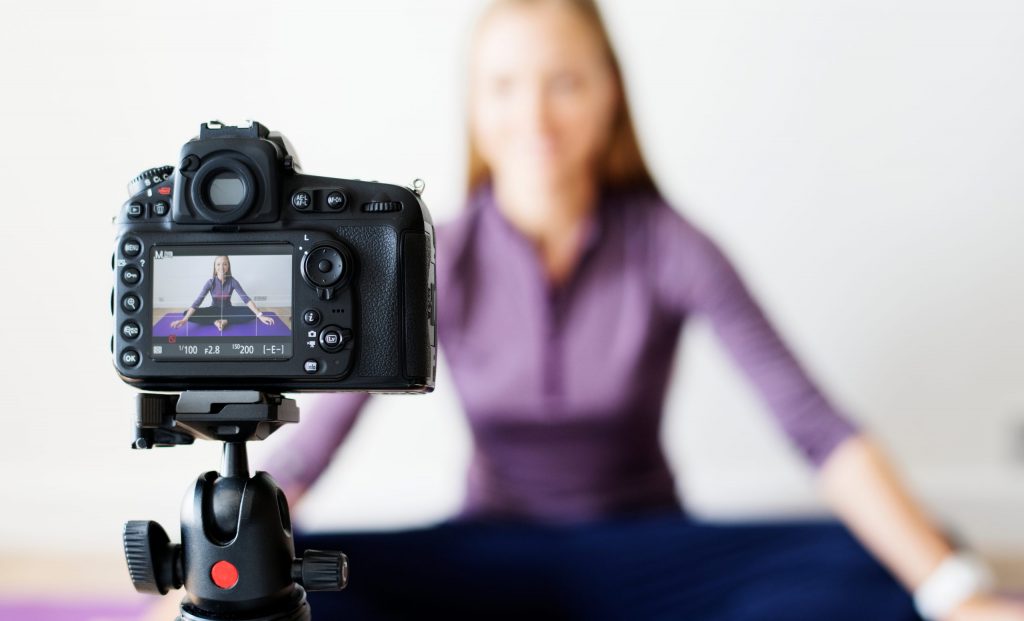 small business video marketing yoga instructor in front of camera