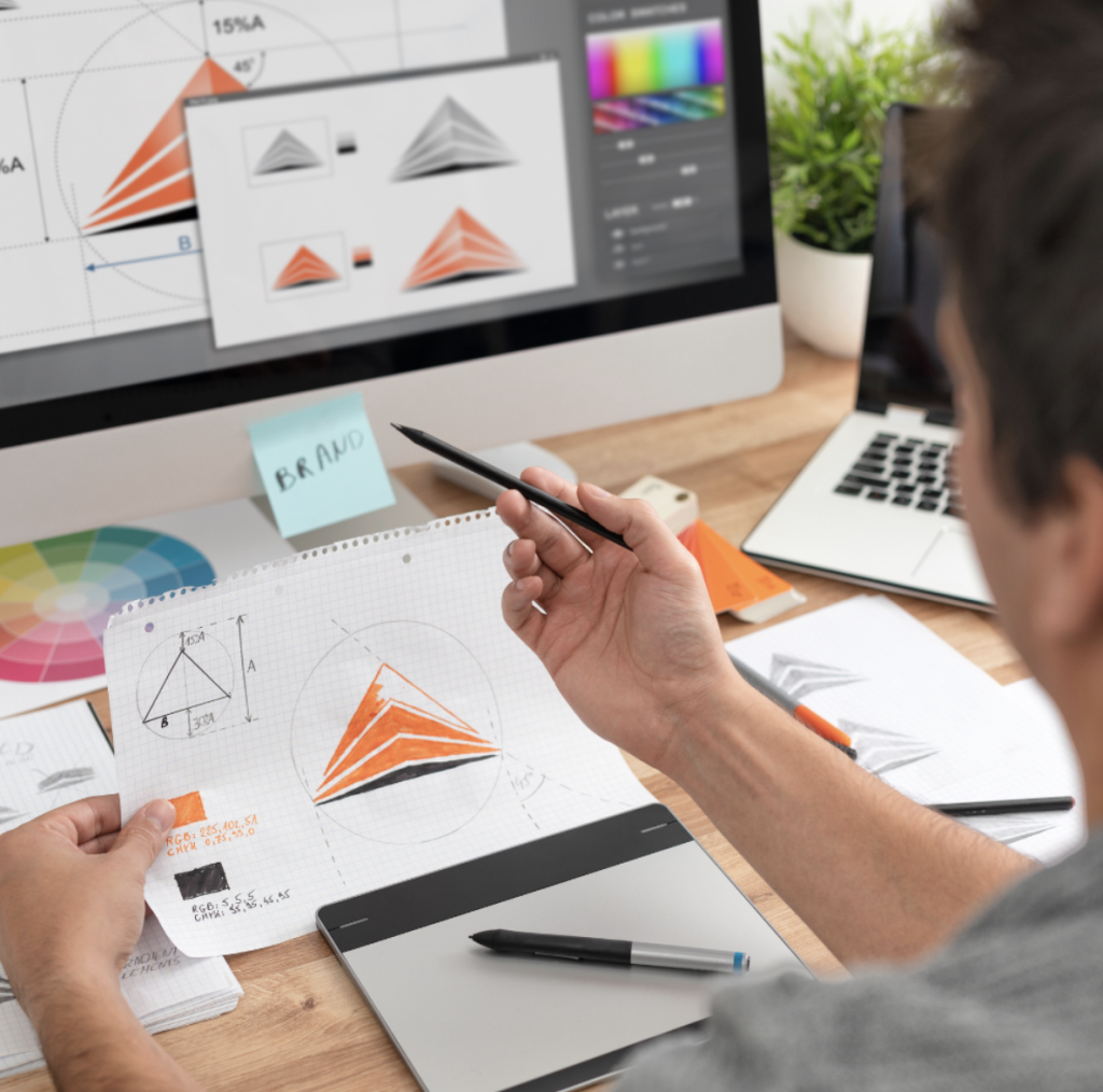 How to create an effective logo design: Designer pointing at screen