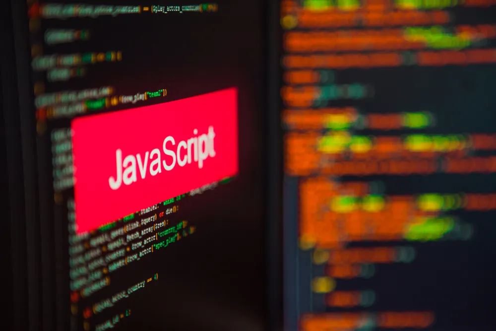 Improve website performance | screen with coding and 'javascript' written
