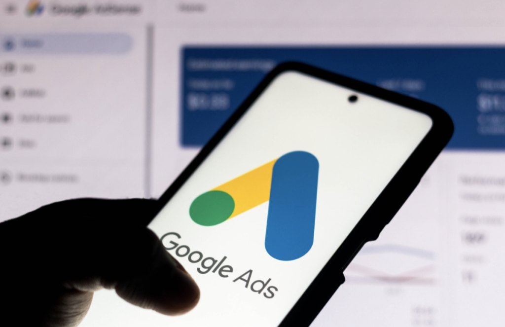 Google Ads on mobile - logo and shadow hand