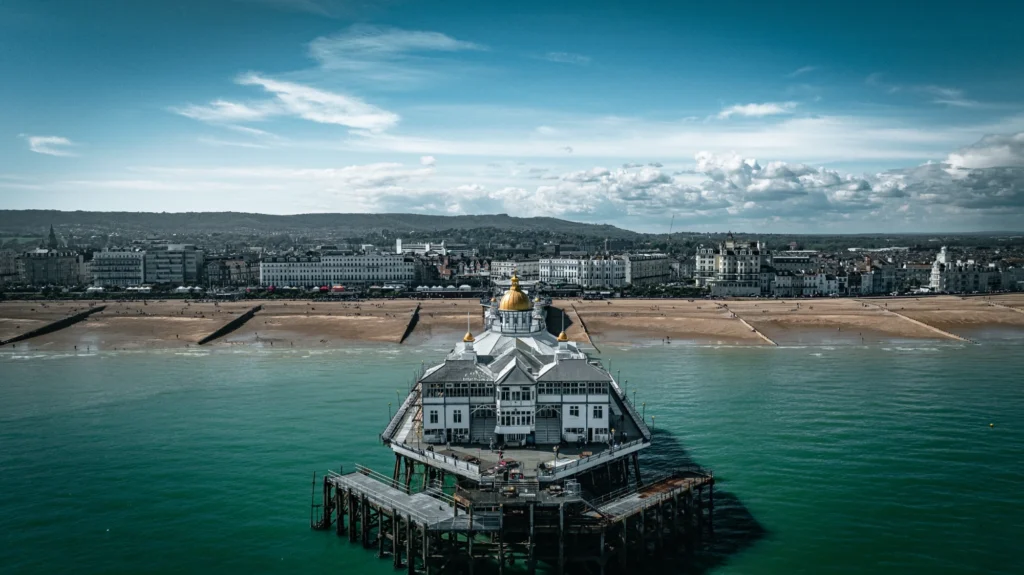 Digital marketing Eastbourne pier facing photo back onto land