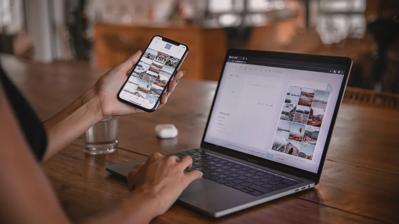 Laptop and phone showing searching for content marketing services