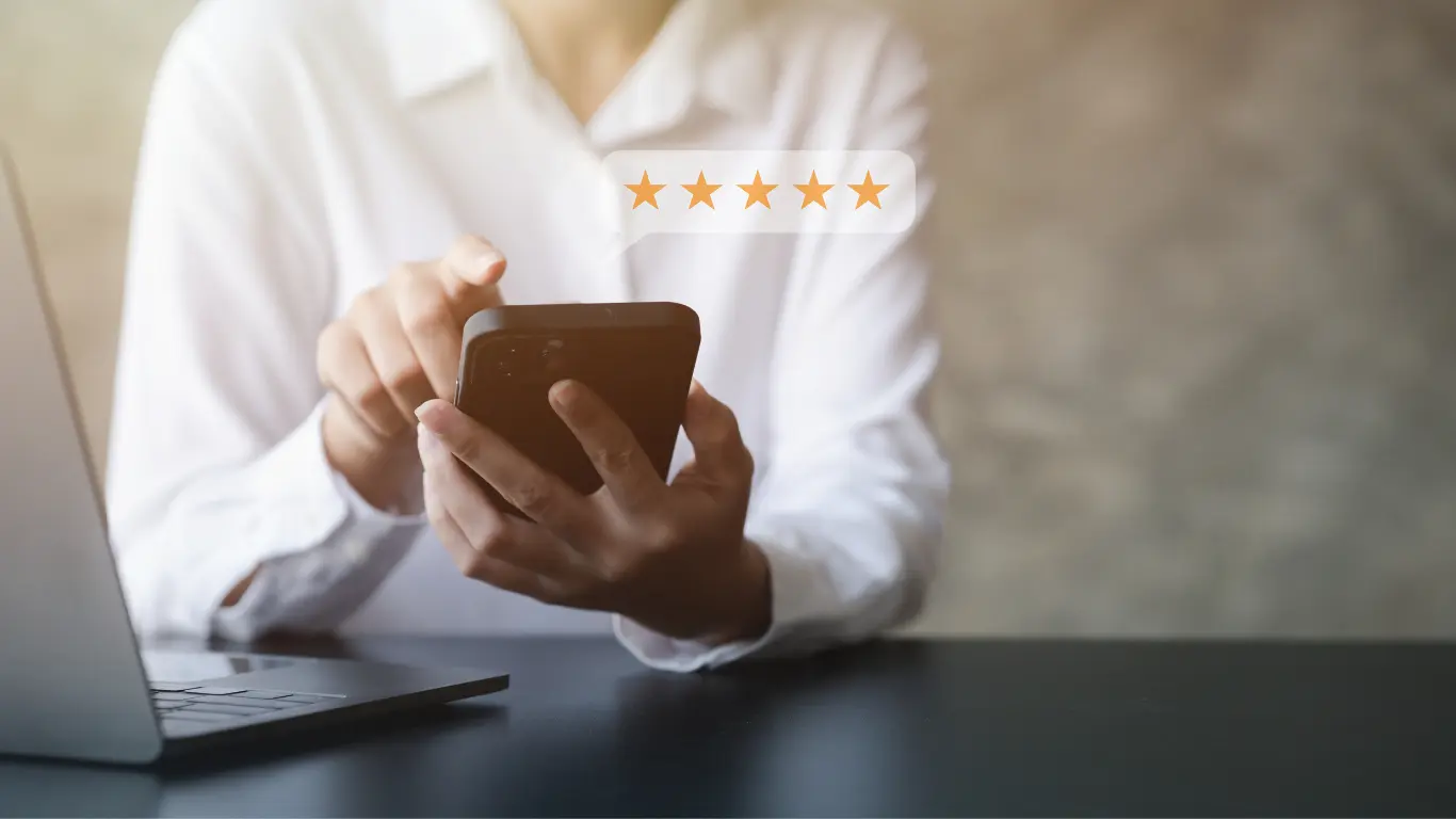 5 star review searched for by a person scrolling their mobile phone