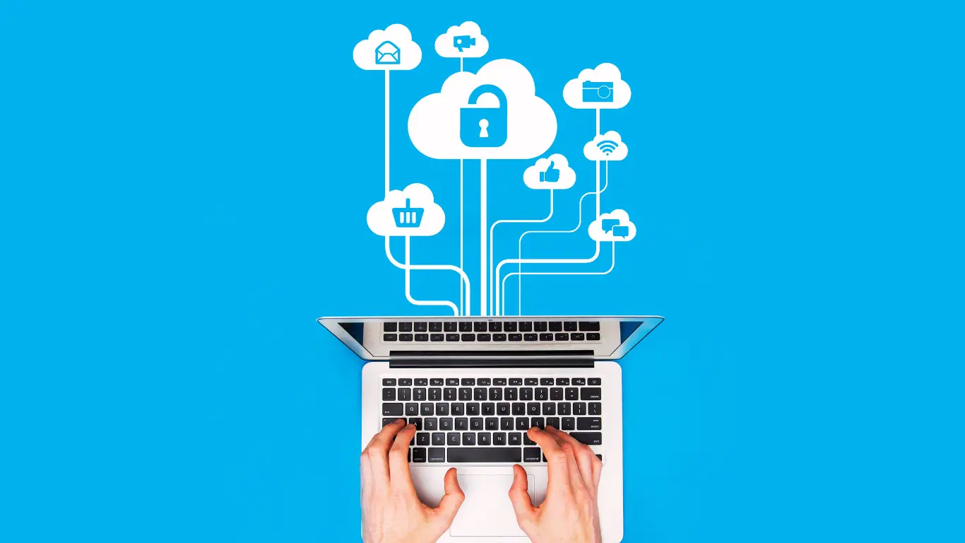 laptop with lines to clouds which have inside them a padlock icon, shopping basket icon, thumbs up icon, email icon, wifi icon, speech icon, camera icon